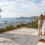 Couple on Riviera villa terrace admiring sea