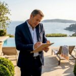 Estate manager on terrace with luxury amenities