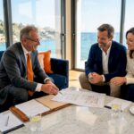 Advisor and clients review luxury home plans