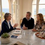 Luxury property negotiation in French villa kitchen
