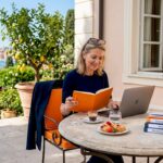 Advisor reviews notes in a sunlit boutique office