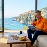 Coastal homeowner enjoying waterfront view indoors