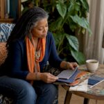 Woman reviewing fabric swatches in maximalist living room
