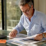Man reviewing investment property papers