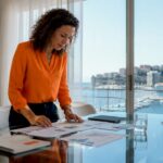 Real estate analyst reviewing market reports