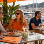 Couple networking on beach terrace with drinks
