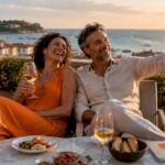 Couple enjoying drinks on luxury beach terrace