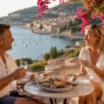 Couple enjoying drinks on sunny beach terrace