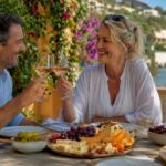 Couple enjoying drinks on Côte d'Azur terrace
