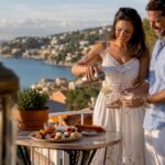 Couple pouring drinks on Côte d'Azur villa terrace