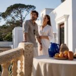 Couple assessing a sunny Ibiza villa terrace