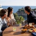 Couple comparing coastal properties with buyer agent