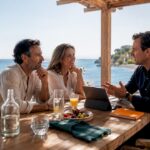 Couple questioning buyer agent beside Ibiza beach