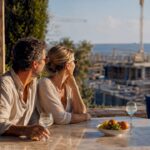 Happy couple viewing anonymous new-build construction